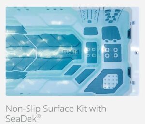 Blue SeaDek non-slip boat deck kit installed on a light-colored surface, showing textured blue panels and raised grip areas.