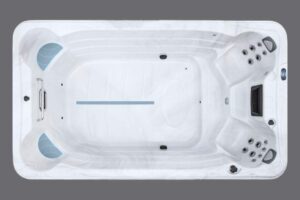 Top-down view of a white rectangular hot tub with multiple jet seats at both ends and a blue center line.