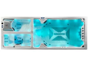 Large rectangular hot tub with blue LED lighting and multiple seating areas, including two small seats on the left and a lounge on the right.